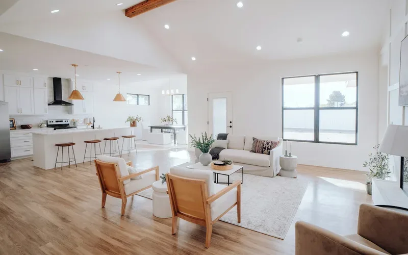 Bright open-plan living room and kitchen after a residential cleaning
