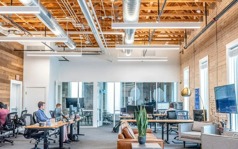 Open-plan office with desks and meeting areas